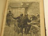 un vieux livre sur lequel figure la photo d'un groupe de personnes assises autour d'une table