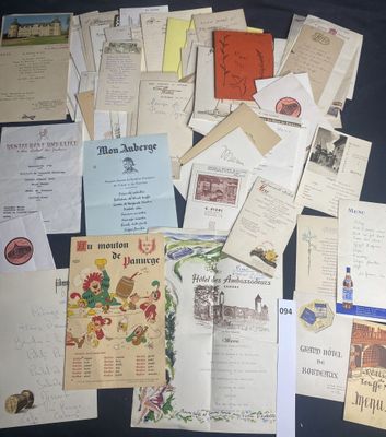 many old letters and old postcards on the table
