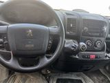 a dashboard of a truck with a steering wheel and dashboard controls