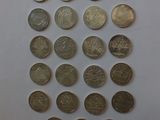 a close up of a bunch of coins sitting on top of a table