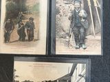 three old postcards of people walking down a street in a town
