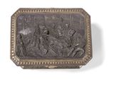 an antique silver box with a picture of a man and a woman on horseback