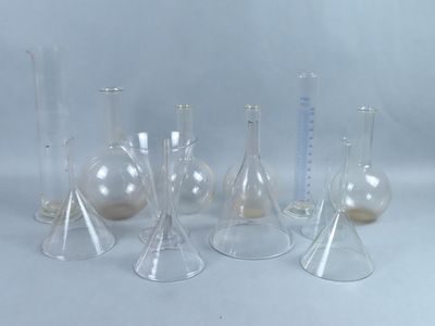a group of glass vases that are sitting on a table