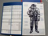 an open book with a drawing of an astronaut on it