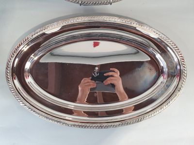 a person taking a picture of themselves in a mirror