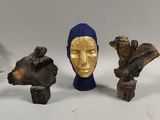 several pieces of art that are sitting on a white surface