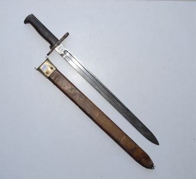 an old dagger and a knife on a white surface