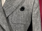 a close up of a jacket on a mannequin mannequin