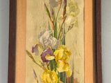 painting of yellow and purple flowers in a wooden frame on a wall