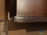 a close up of a wooden shelf with a phone on it