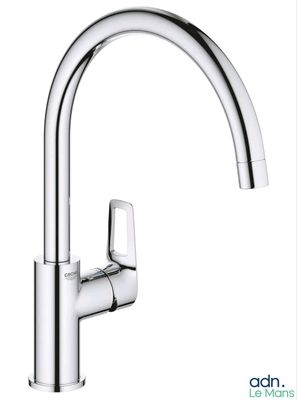 a close up of a kitchen sink faucet with a chrome finish