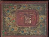 un vieux livre à la couverture rouge ornée de plumes de paon