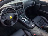 a dashboard and steering wheel of a sports car
