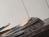 a broken piece of metal sitting on top of a stove
