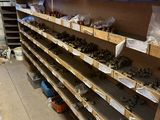 a shelf with lots of tools on it in a room
