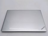 a silver laptop sitting on a white table