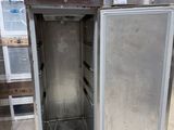 a silver refrigerator with a blue door in a store