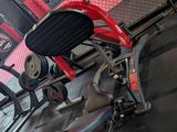 a red scooter that is sitting on the floor