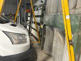 a white van that is parked in a garage