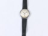 wrist watch with black leather strap and white face on a white background