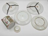 four plates and two cups on the table