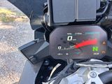 a close up of a motorcycle with a speedometer on it ' s dashboard