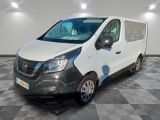 the white van is parked on a checkered floor in a room