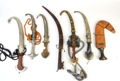 a lot of different types of knives on a white surface