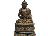 une image représentant une statue de Bouddha assis sur une table
