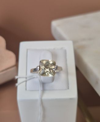 a ring that is sitting in a box on a table