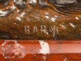 a close up of a statue of a horse on a table