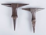 pair of antique blacksmith tools on a white background