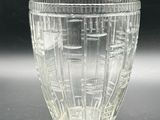 a glass cup that is sitting on a table