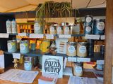 many jars of food on the shelves in the store