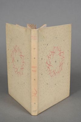 an old book with writing on it sitting on top of a table