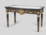 un bureau peint en noir et or, avec un plateau en miroir