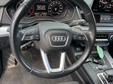 a car dashboard with a steering wheel and a dash board