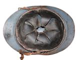 a metal helmet with a hole in the middle of it