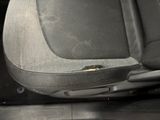 a close up of a car seat with a hole in it