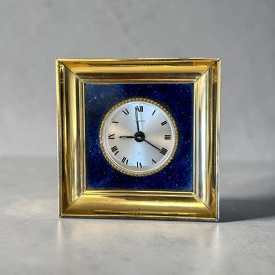 a small clock that is sitting on a table
