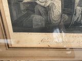 a picture of a woman sitting in a chair in front of a painting