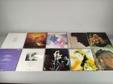 various cd ' s on a table with a white background
