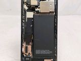 a picture of a cell phone with a broken battery
