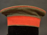 a close up of a military hat on a mannequin head