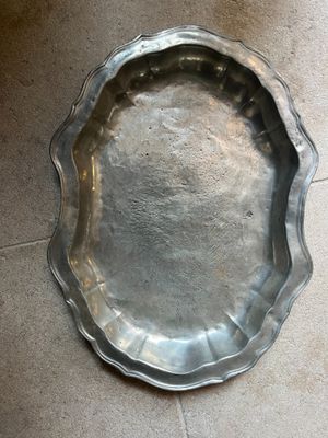 a silver tray on the floor on the floor