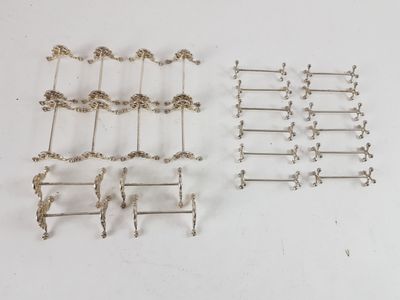 six pairs of silver plated metal hooks and a pair of silver plated hooks