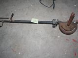 a picture of a metal pipe clamp on the ground