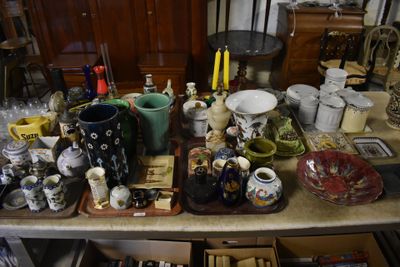 a table with many different types of vases on it