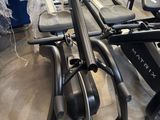 an image of a row of stationary exercise bikes in a gym