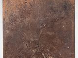 an image of a piece of rusted metal on a white surface